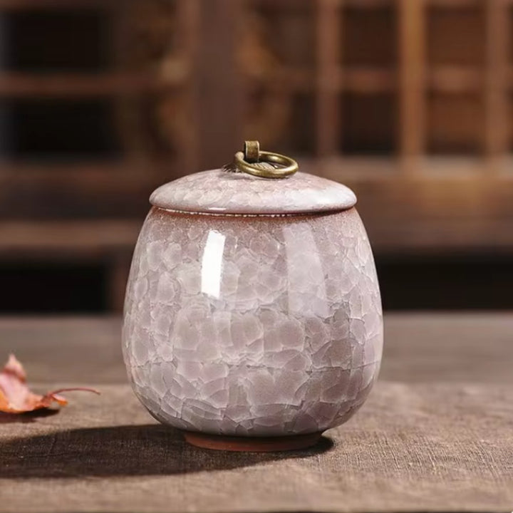 Comforting ceramic pet urn, craquelé glaze, a loving tribute for beloved pet ashes.