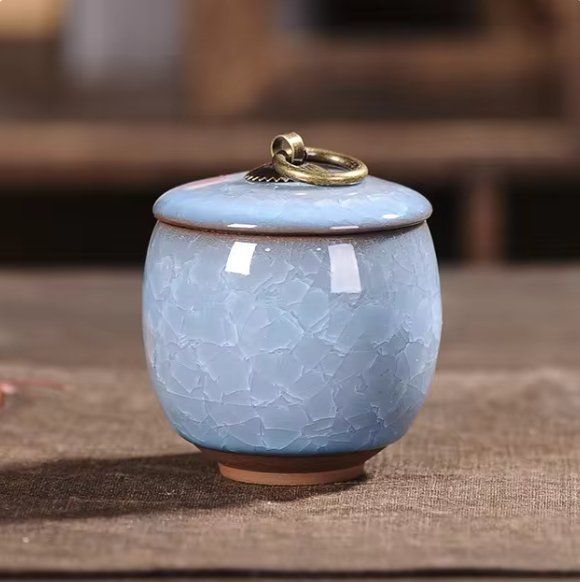 Decorative ceramic pet urn with craquelé glaze, a tasteful pet memorial for any home.