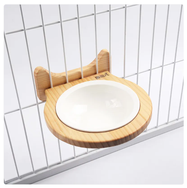 Stylish elevated cat food bowl, wall-mounted with an elegant cloud wooden frame. Essential modern cat care accessory.