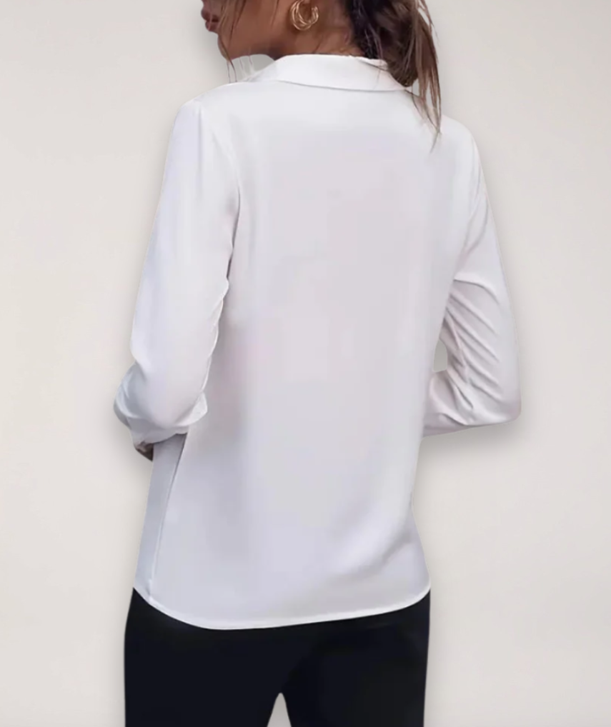 White women's elegant tailored work blouse with classic button-up front, ideal for office apparel.