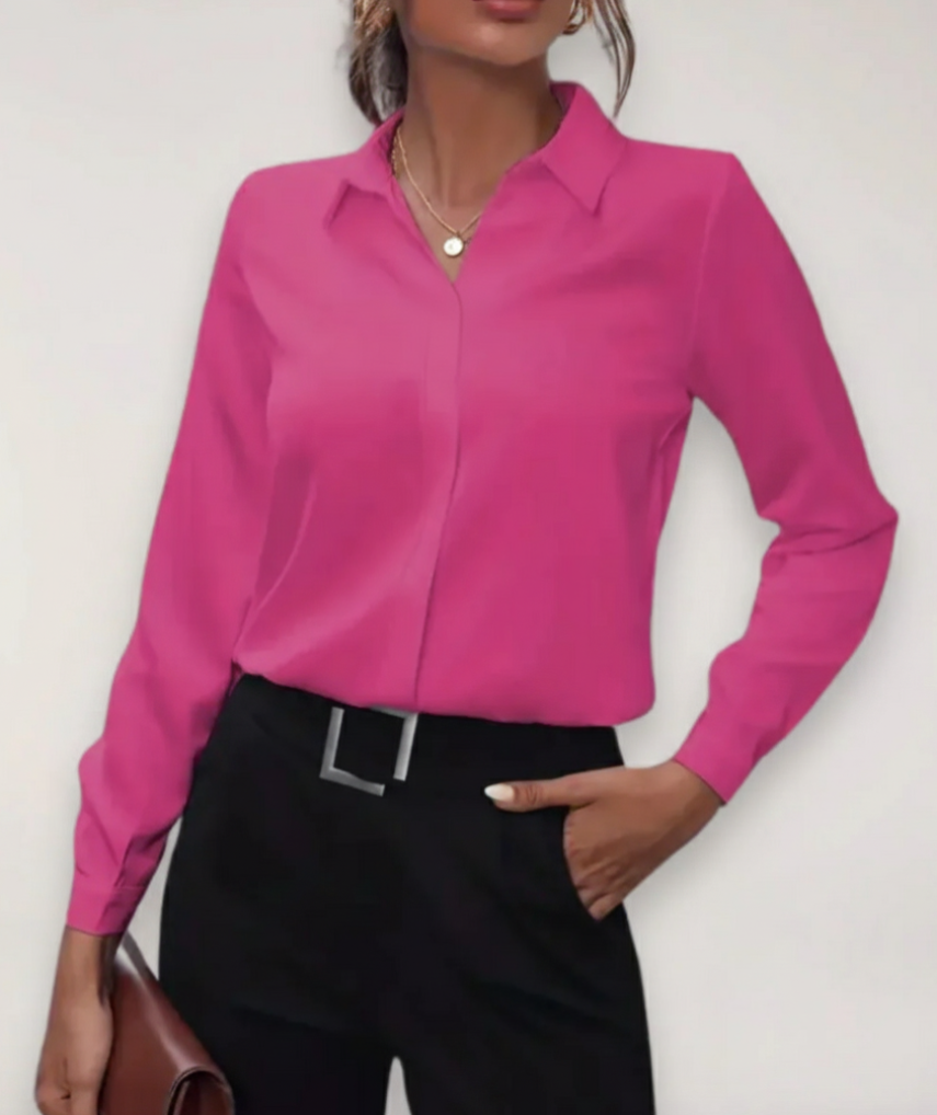 Close-up of a women's tailored work blouse, showing button details and smooth fabric for office fashion.