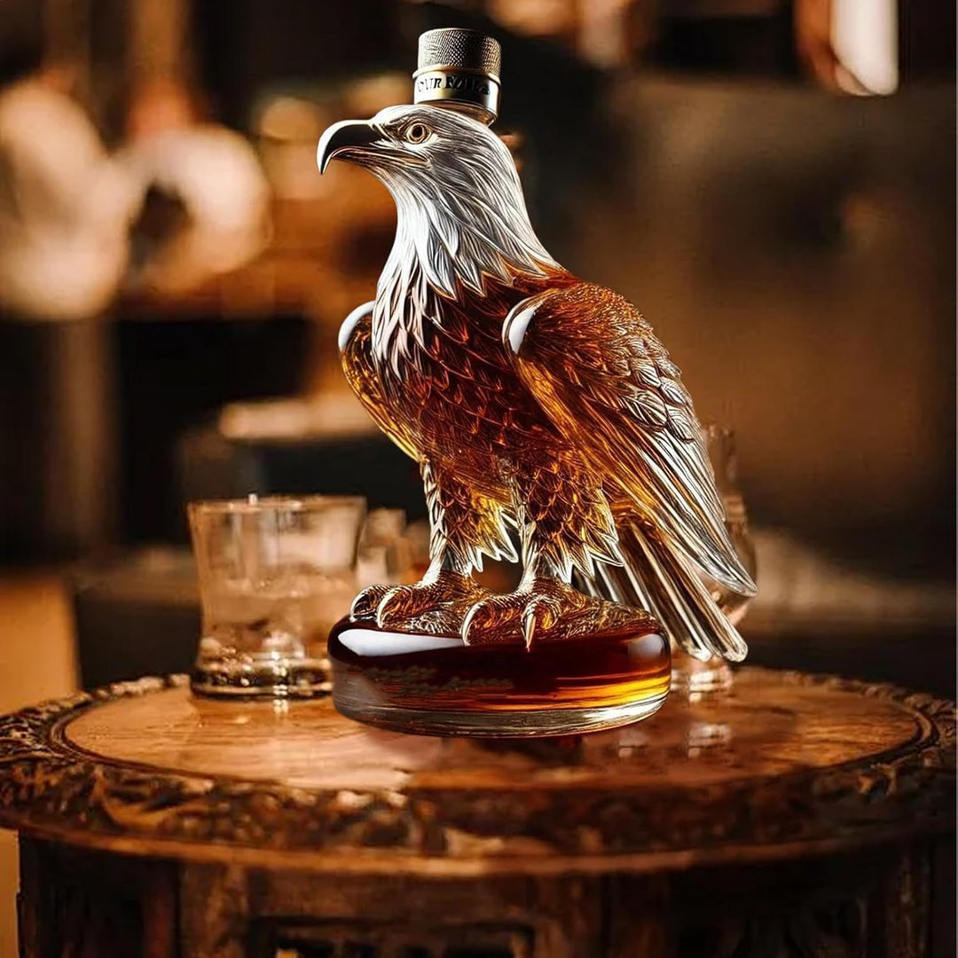 Elegant eagle-shaped glass decanter for whiskey & spirits. Unique borosilicate barware display and home decor gift.