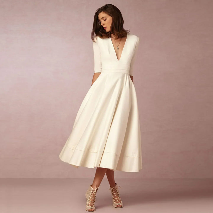 Elegant fitted midi summer dress for women, perfect for a classic and fashionable look.