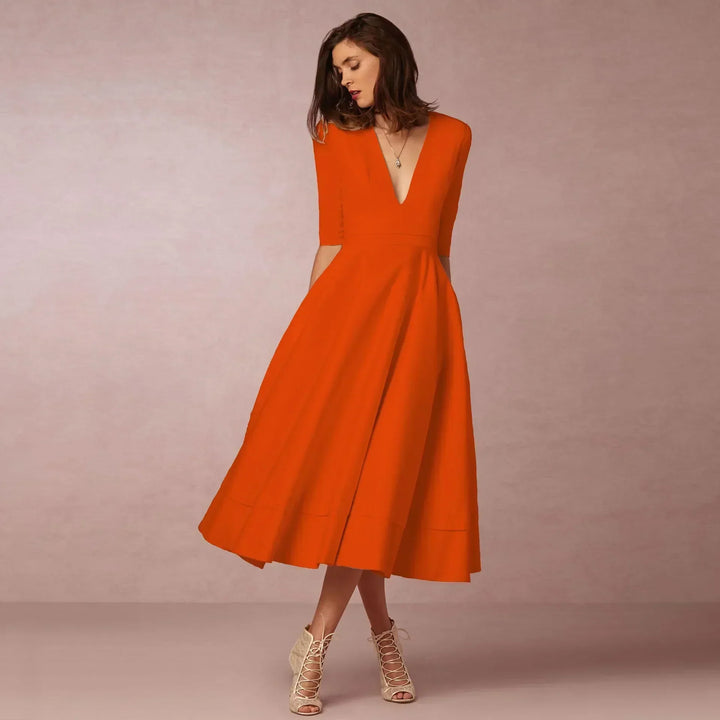 Chic women's elegant midi dress for summer, highlighting a flattering and modern design.