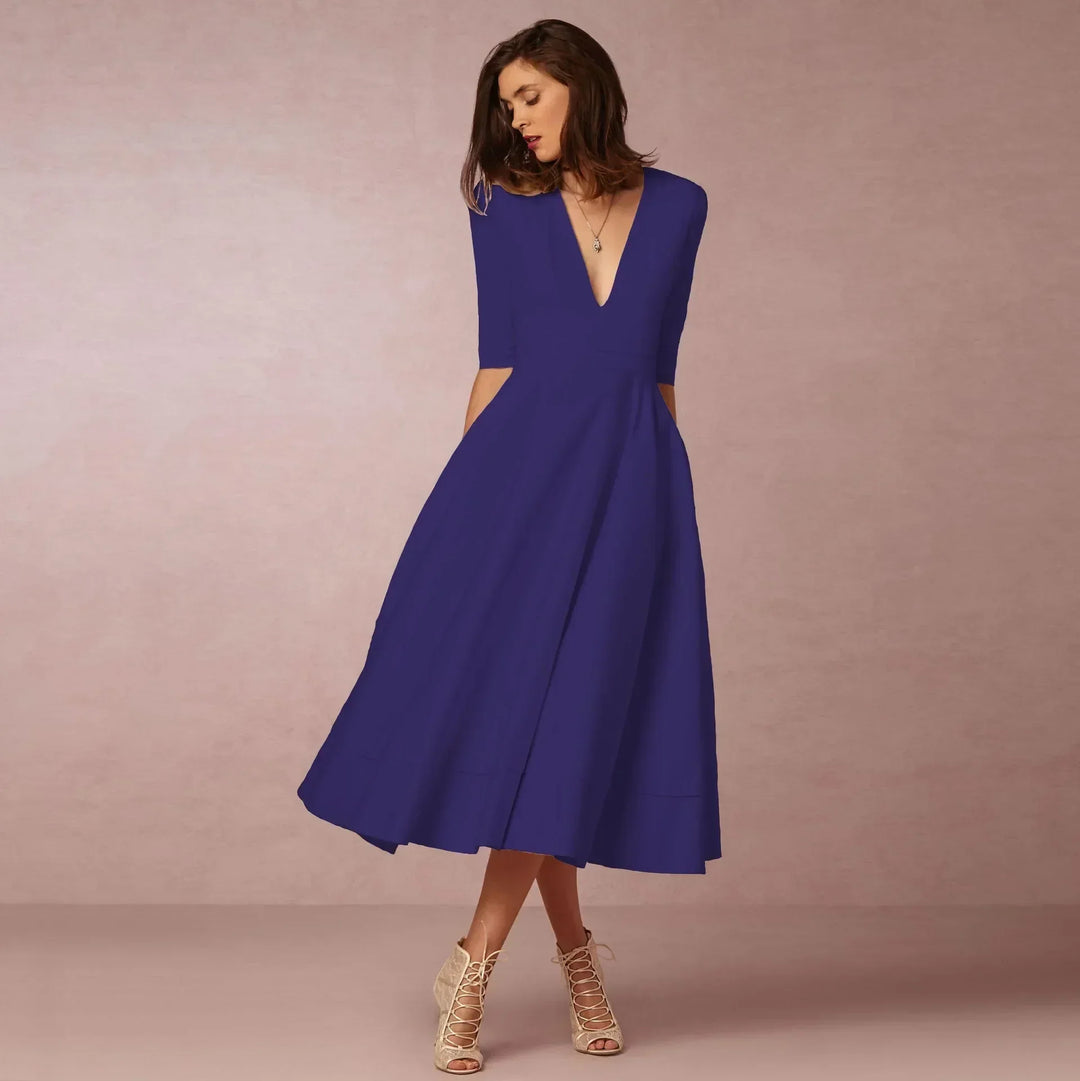 Women's sleek sleeveless midi dress, ideal for summer casual or day wear. Feminine fashion.