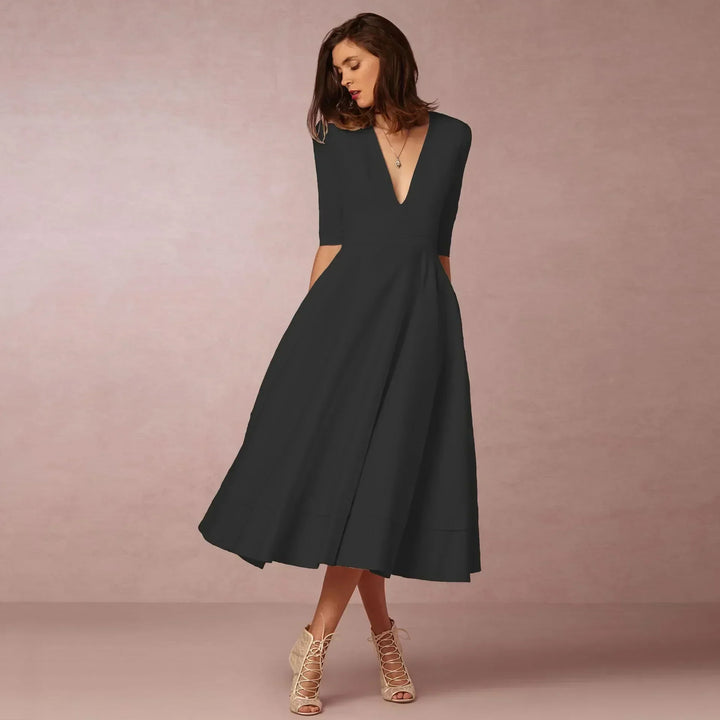 Fitted summer midi dress for women, offering a blend of comfort and timeless elegance.