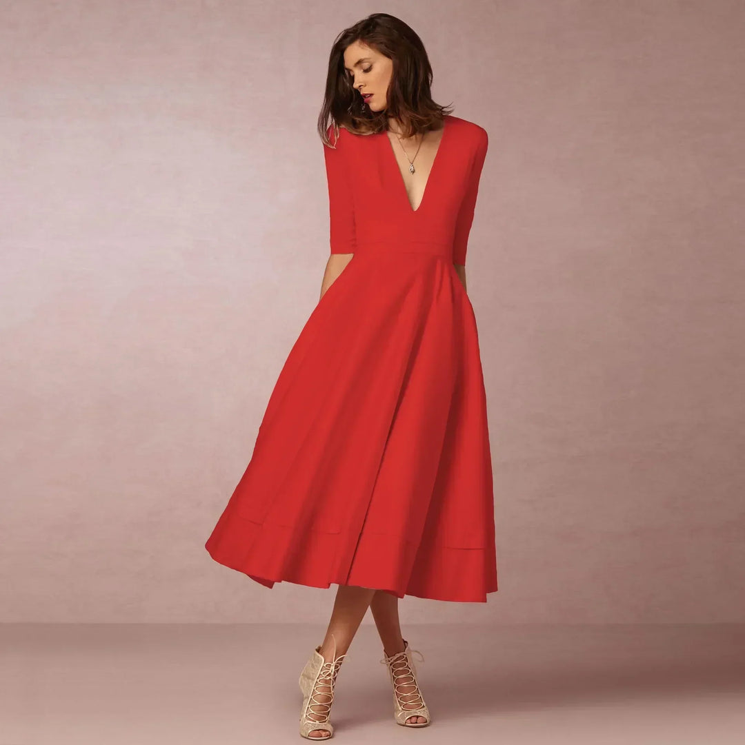 Elegant women's midi dress with a fitted silhouette, showcasing summer style and class.