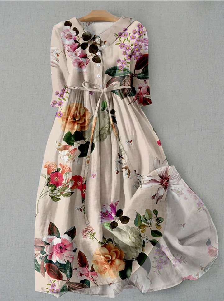 Lightweight women's floral summer dress with button-down front & tie waist. Ideal for beach wear or casual outings.
