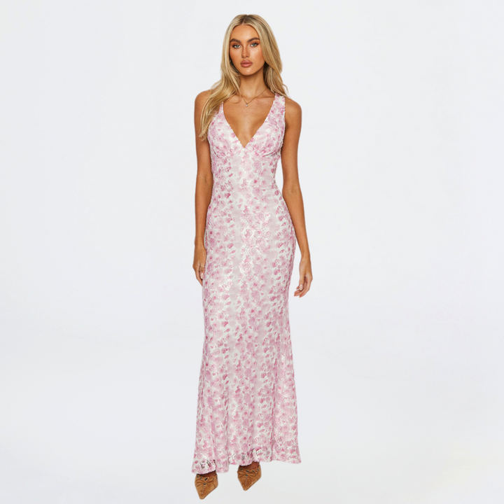 Elegant floral pink maxi dress for women, ideal wedding guest attire, shown front view.