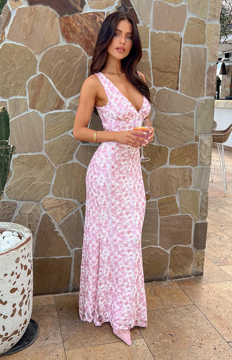 Side profile of women's summer floral maxi dress, highlighting its graceful drape and print.