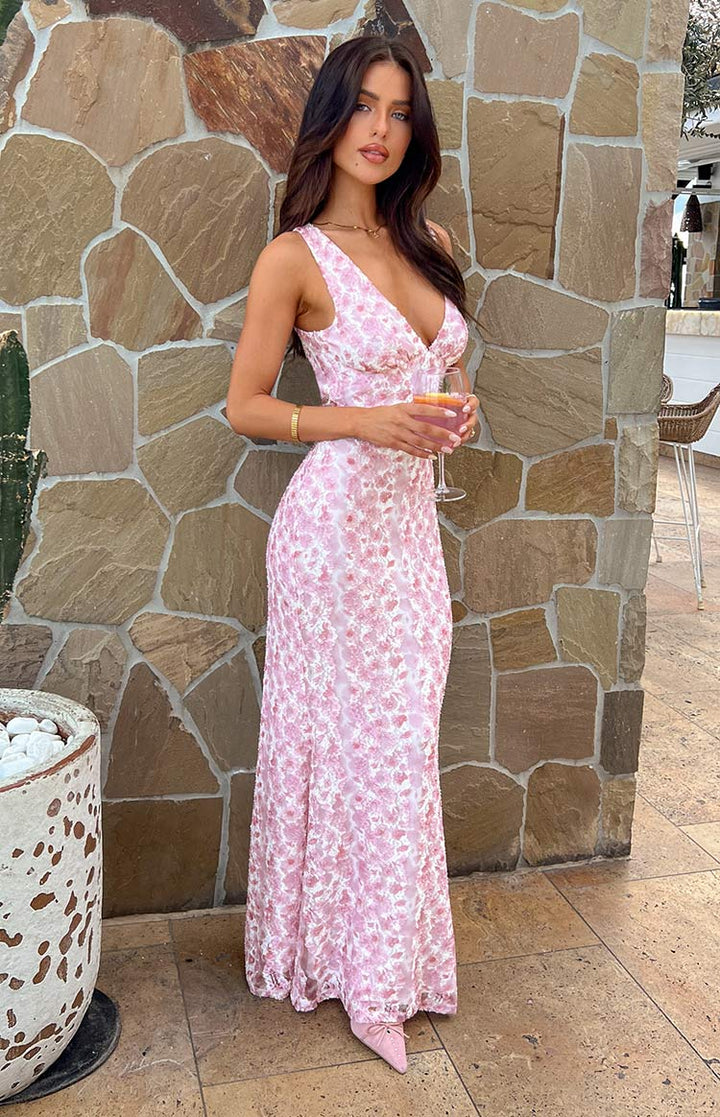 Side profile of women's summer floral maxi dress, highlighting its graceful drape and print.