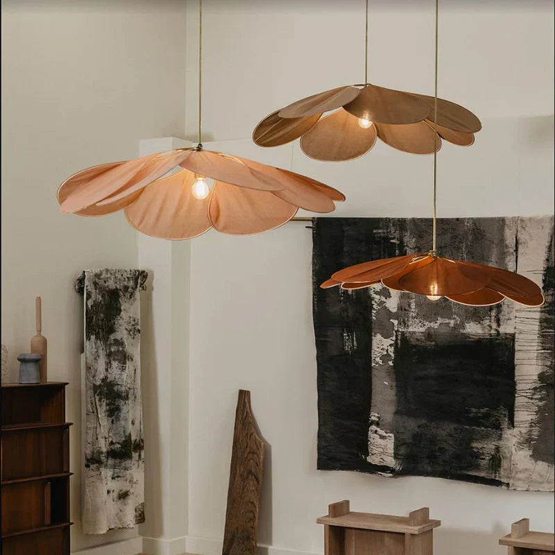 Natural woven flower pendant light, adding a bohemian touch & ambient glow to any living space.