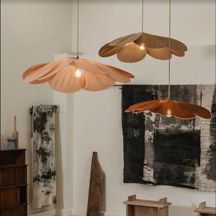 Natural woven flower pendant light, adding a bohemian touch & ambient glow to any living space.