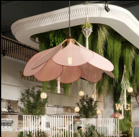 Unique flower pendant light with natural woven design, enhancing home decor with elegant ambient glow.