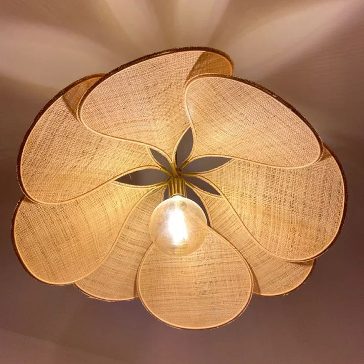 Woven flower ceiling lamp providing a soft, ambient glow, perfect for serene bedroom or dining room lighting.