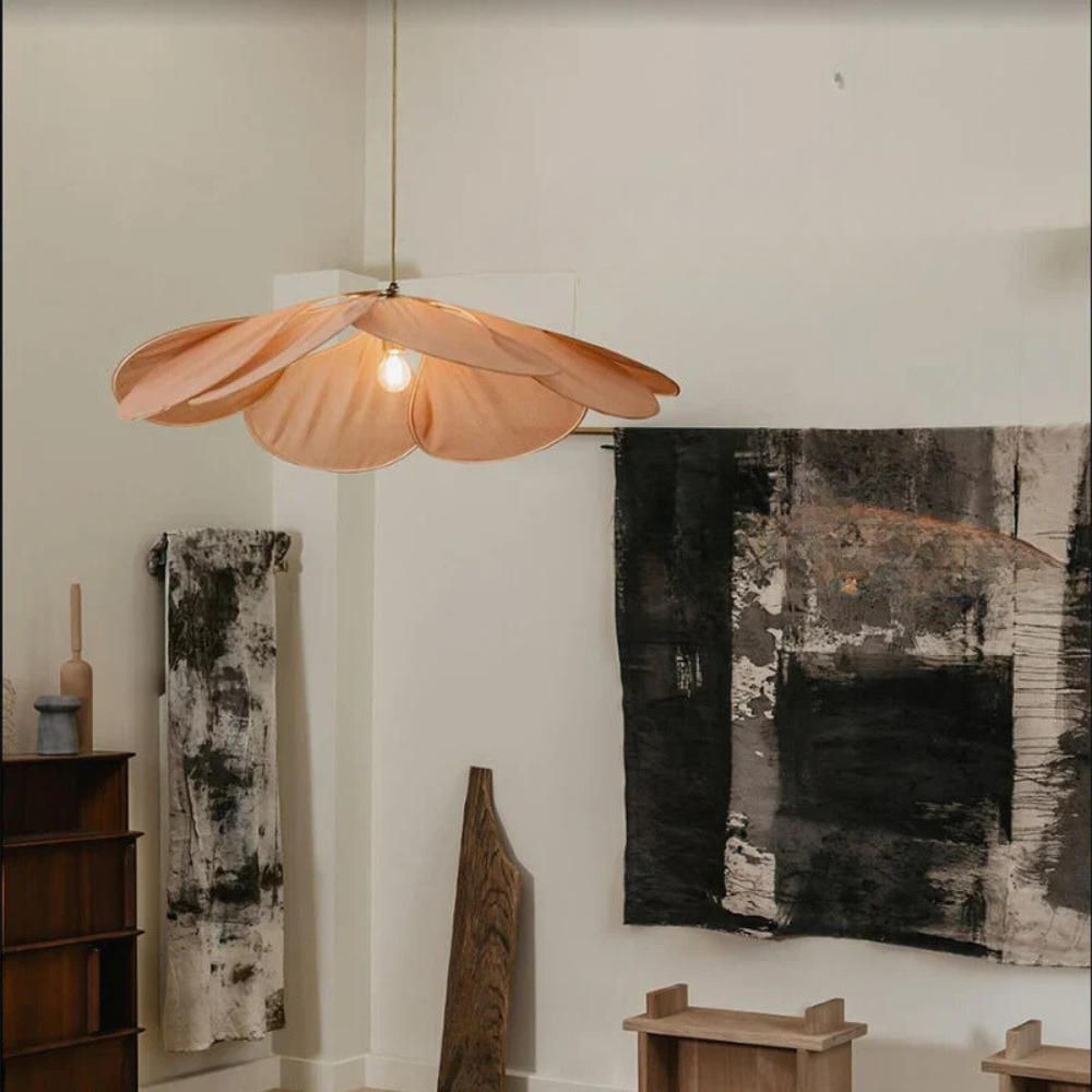 Organic natural woven flower pendant light, bringing a calming, ambient glow and natural decor to any room.
