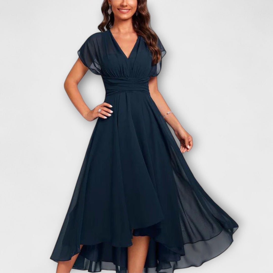 Elegant flowy V-neck A-line maxi dress in blush pink, perfect for summer events.