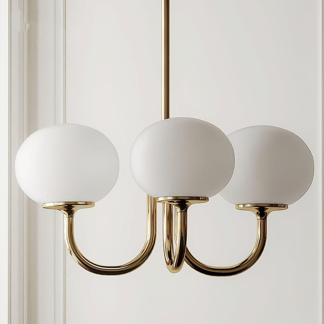 Sculptural brass glass sphere pendant, focal point lighting.