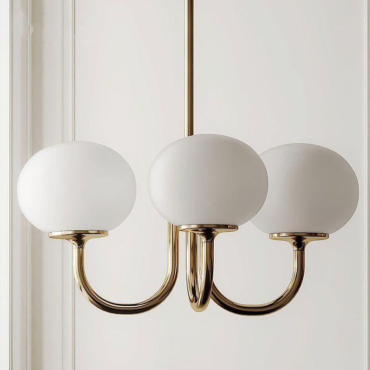 Sculptural brass glass sphere pendant, focal point lighting.