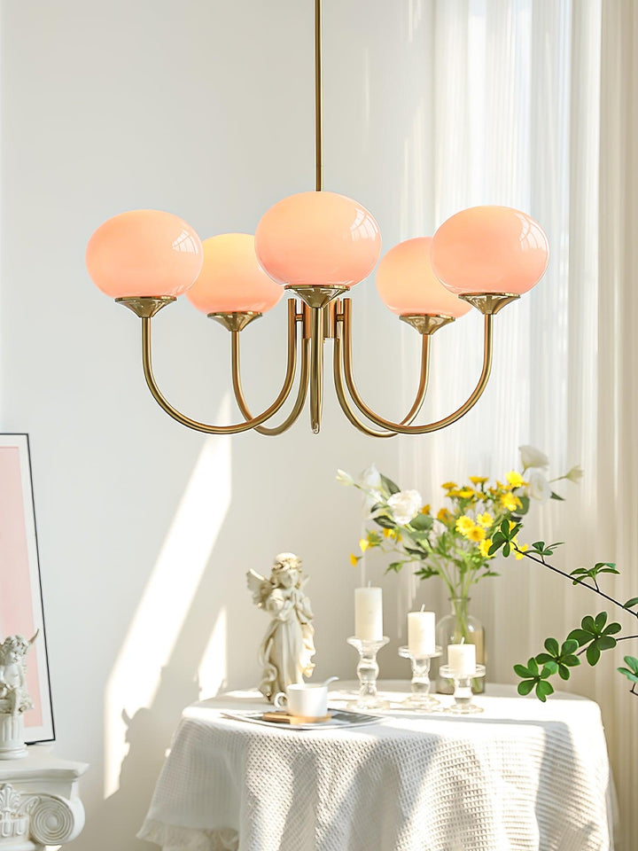 Modern brass pendant with glass globes, living room decor.