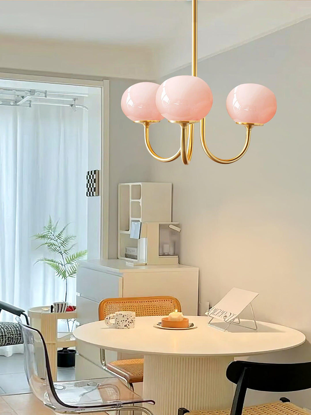 Chic chrome ceiling light featuring multiple glass orbs.