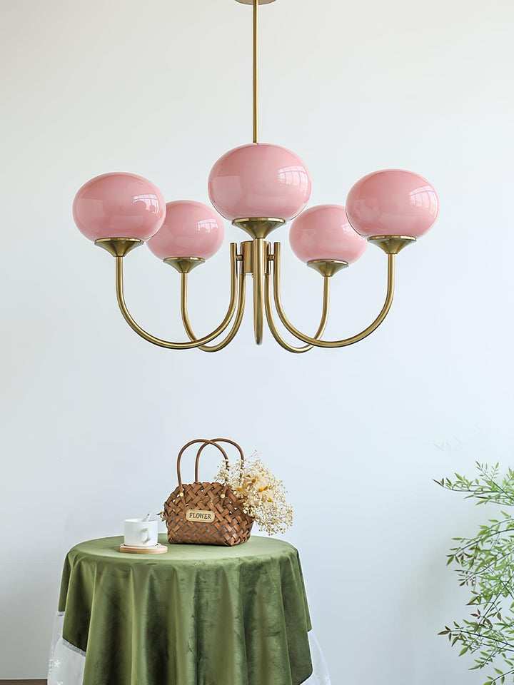 Luxurious brass multi-sphere pendant light for dining.