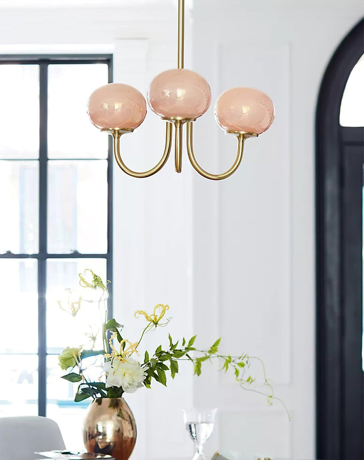 Sleek chrome pendant lamp with spherical glass shades.