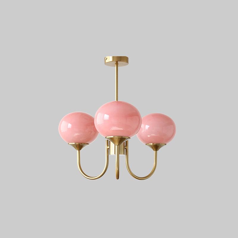 Modern living room ceiling light with brass glass spheres.