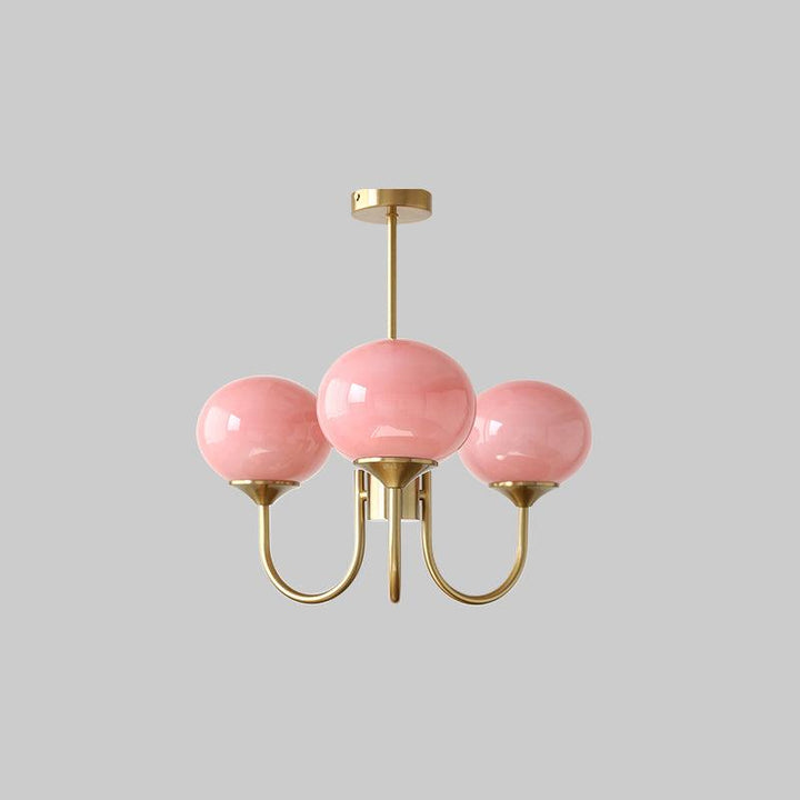 Modern living room ceiling light with brass glass spheres.