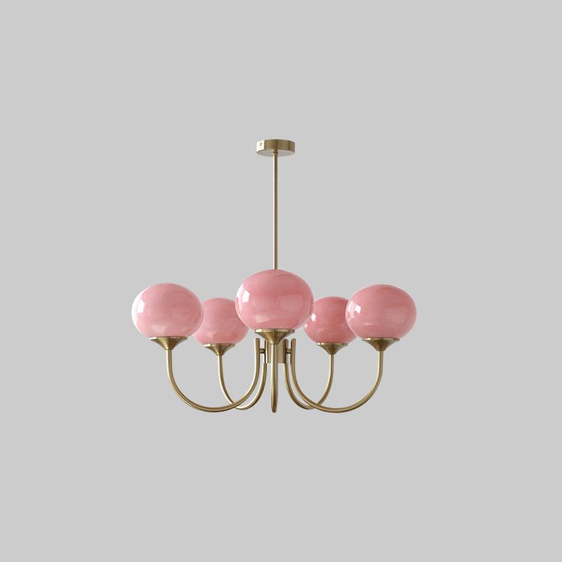 Luxurious glass sphere pendant, brass finish, elegant lighting.