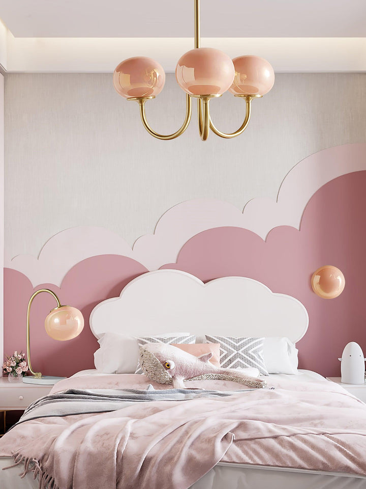 Modern multi-sphere pendant light with brass accents.