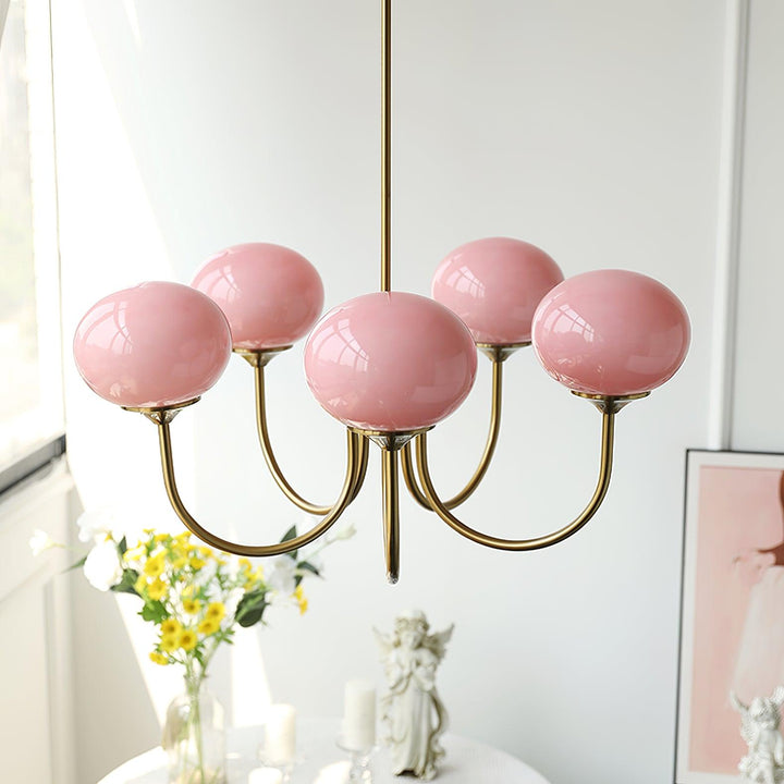 Luxurious brass pendant lamp with glass spheres.