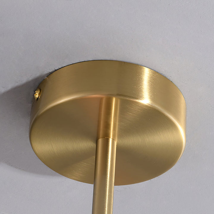 Contemporary ceiling light with shimmering glass spheres.
