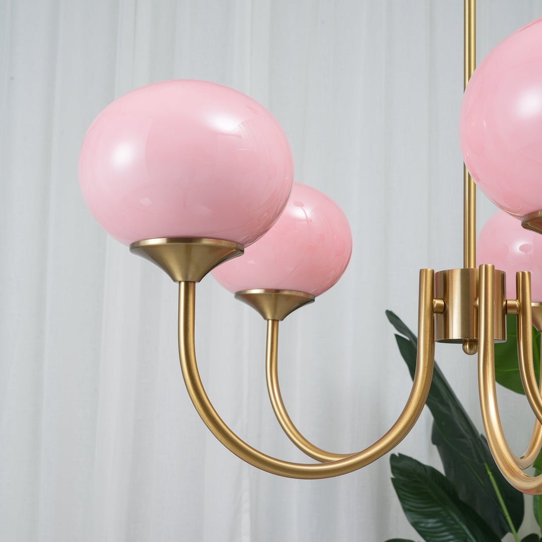 Modern brass pendant, each sphere a source of elegance.