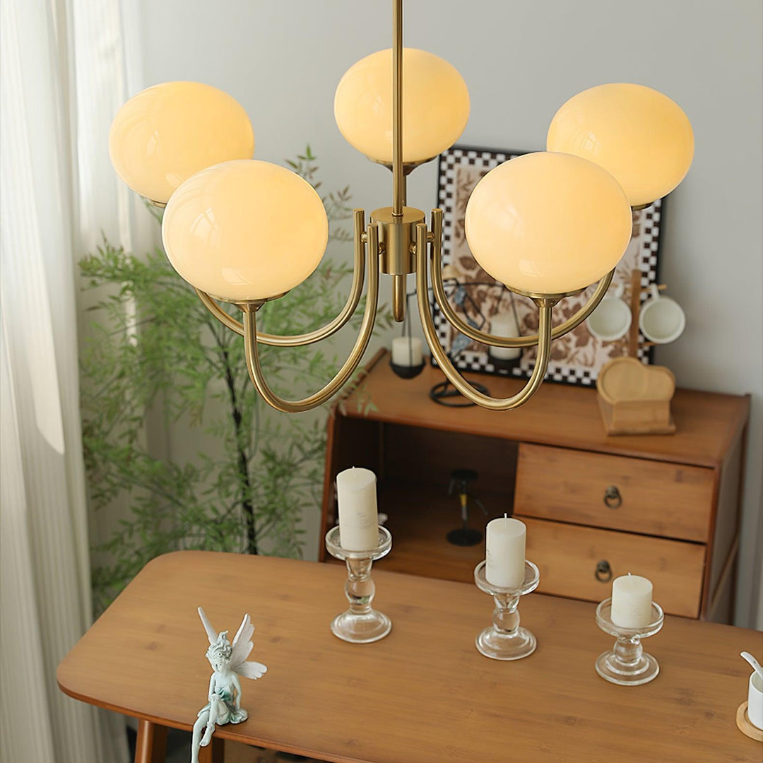 Elegant dining room ceiling light with clear glass spheres.
