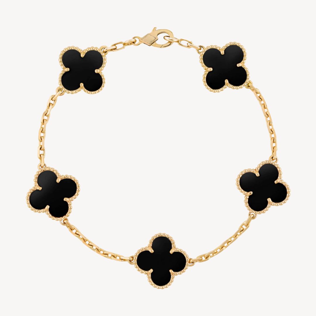 Elegant gold clover charm bracelet for women, perfect fashion accessory or gift.