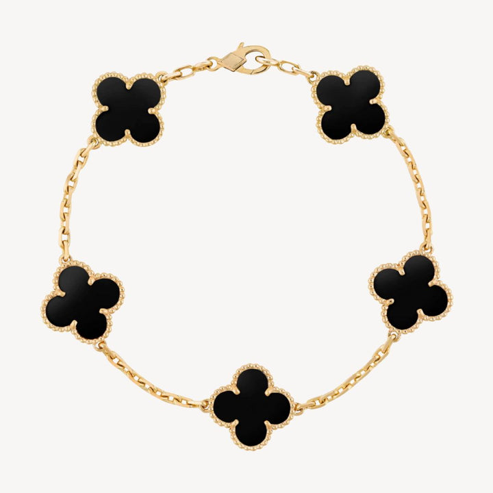 Elegant gold clover charm bracelet for women, perfect fashion accessory or gift.