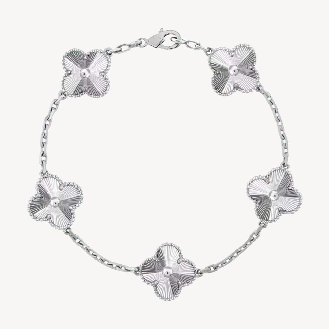 Gold fashion bracelet with unique clover charms, a stylish gift for her.