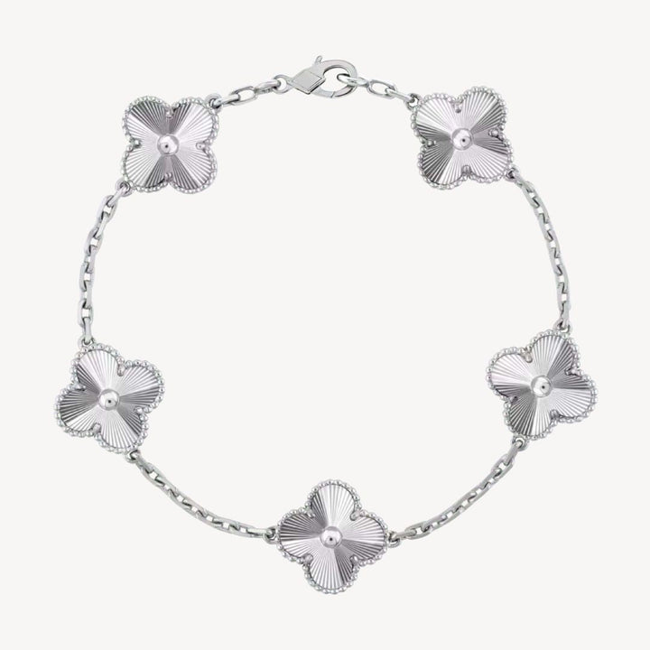 Gold fashion bracelet with unique clover charms, a stylish gift for her.