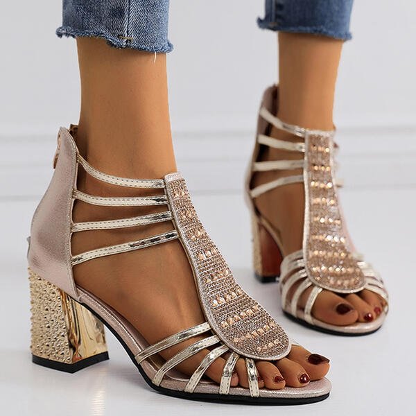 Close-up of a nude strappy block heel, showcasing elegant design and summer style