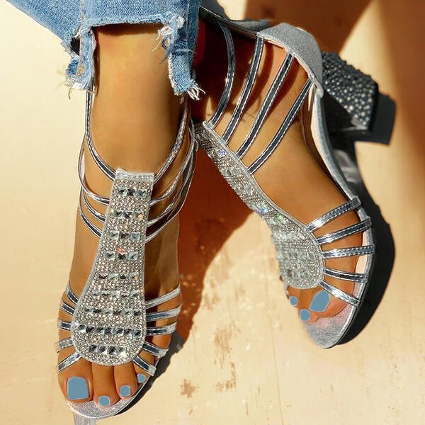 Fashionable red strappy block heels, adding a vibrant touch to women's summer outfits