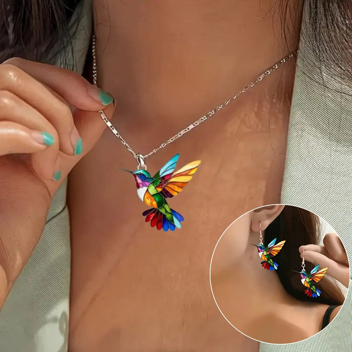 Close-up of a detailed hummingbird necklace, fine jewelry, elegant design.