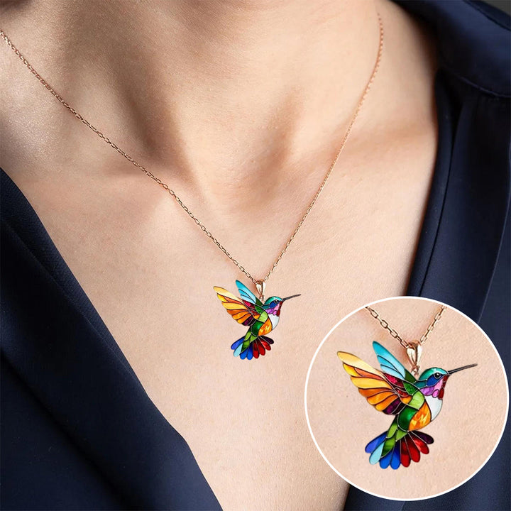 Dainty golden hummingbird earrings, elegant modern accessory for women.
