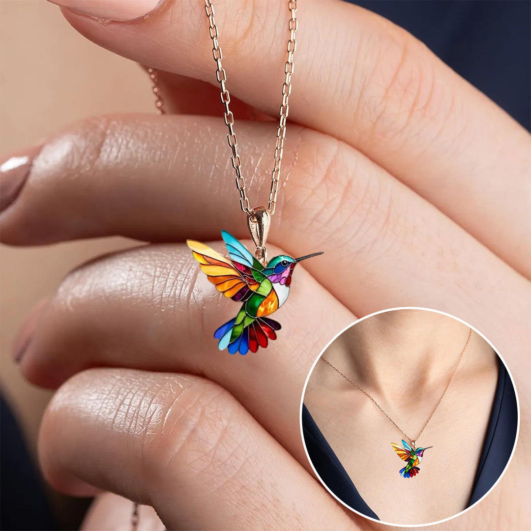 Beautiful silver hummingbird jewelry set, including necklace and matching earrings.