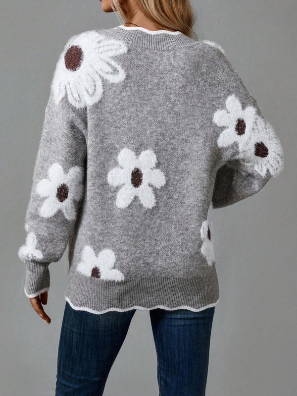 Women's long sleeve V-neck sweater in gray with subtle floral knit for a casual chic look.