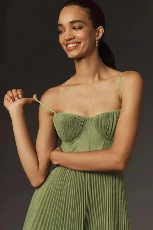 Women's formal green maxi dress with delicate pleats and strappy design for evening wear.