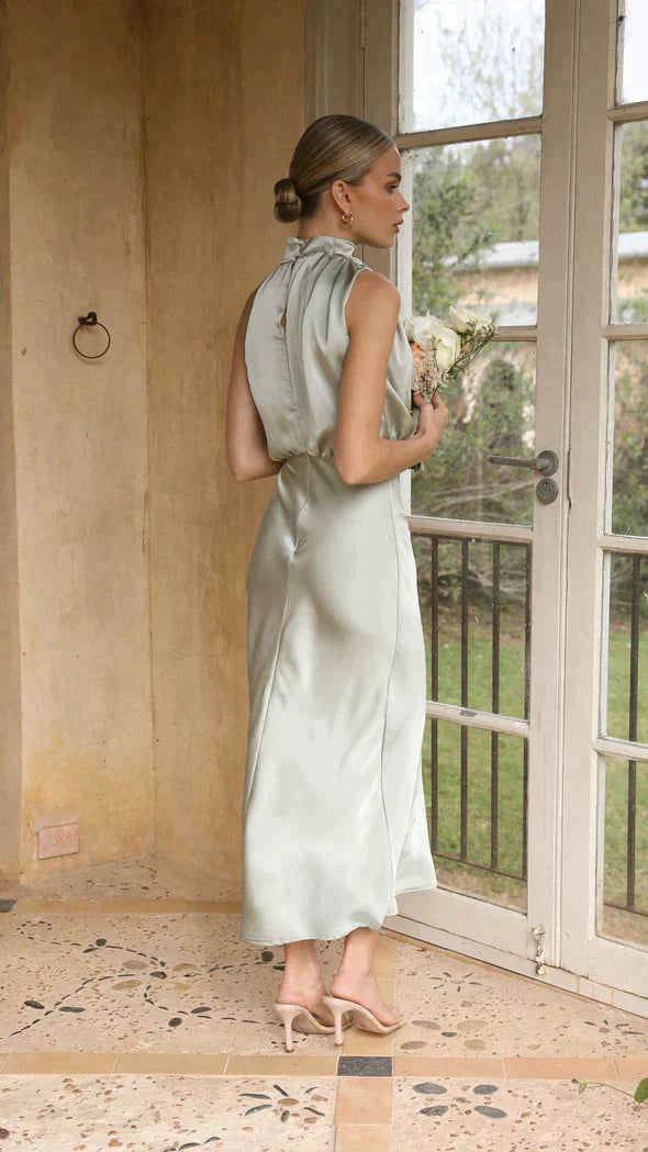 Sophisticated women's halter cocktail dress, draped midi length, suitable for formal occasions.