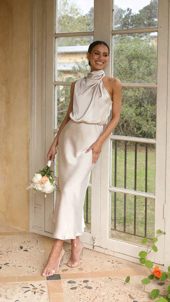 Elegant halter midi dress with draped neckline, perfect for women's evening wear.