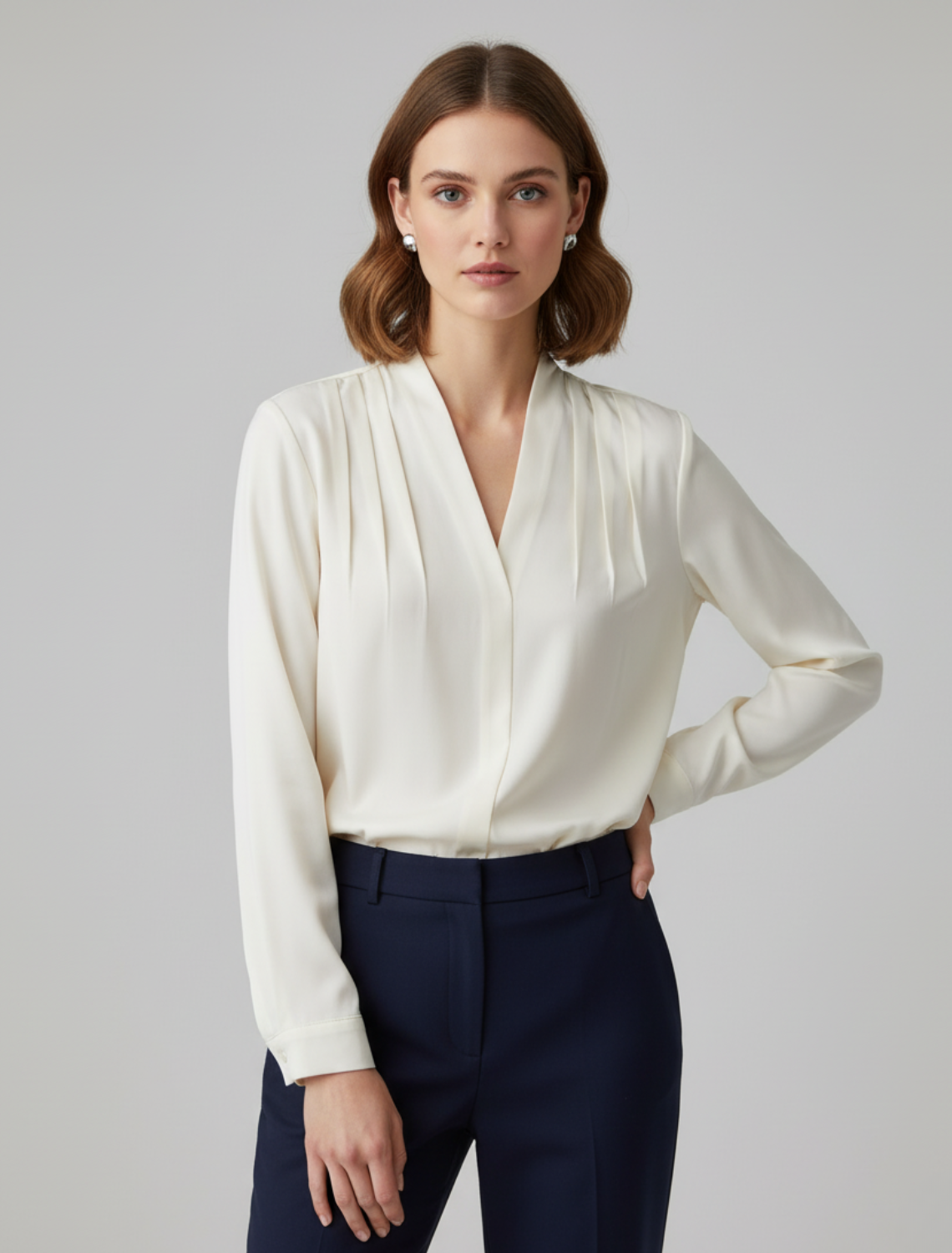 Elegant ivory puff sleeve blouse with tailored waist, perfect for workwear or casual chic summer outfits.