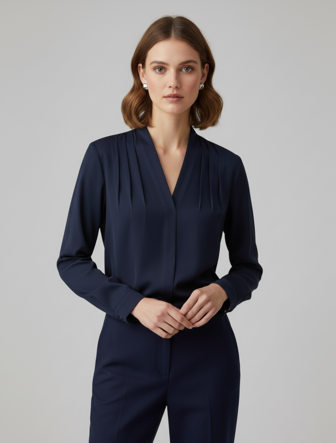 Navy blue women's puff sleeve blouse featuring a tailored waist, a versatile and lightweight summer top.